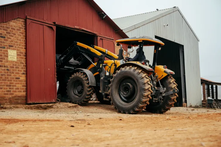 Front loader tractor working a farmyard