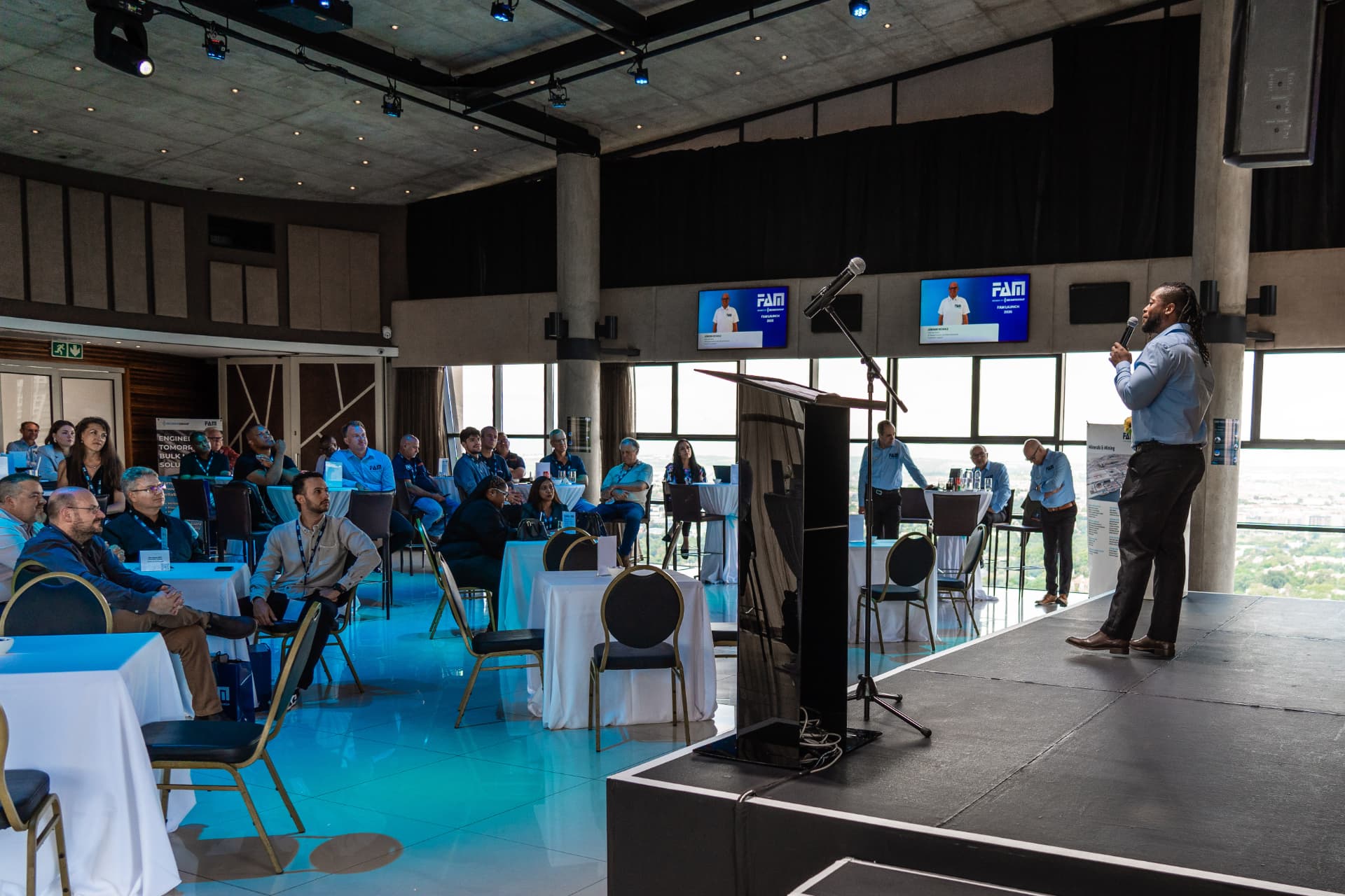 Speaker addressing delegates at a corporate summit