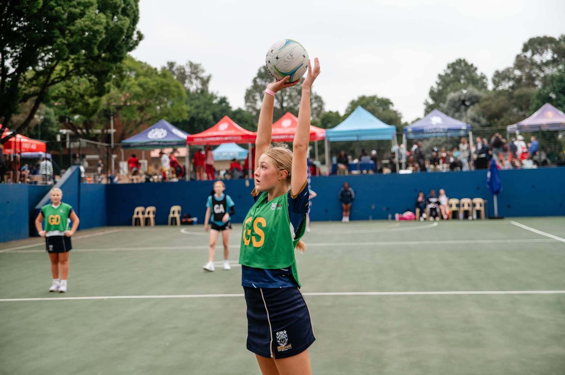 Netball match action at a school tournament
