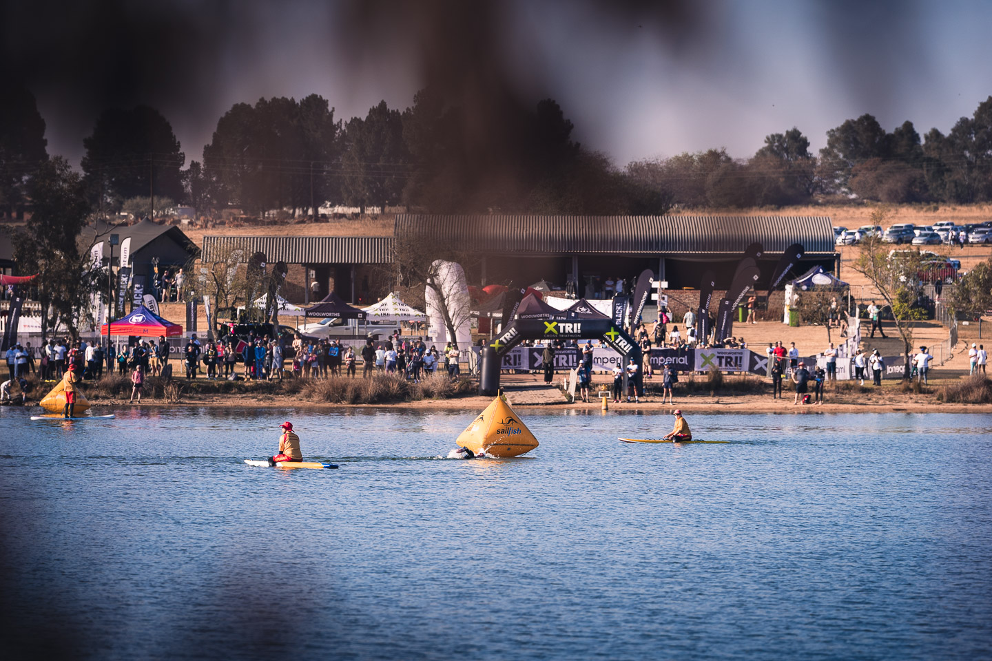 Open water swimmers rounding a buoy at a triathlon